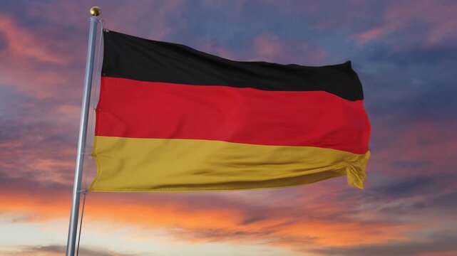 German Flag Waving Gracefully Against a Vibrant Sunset Sky Symbolizing National Unity