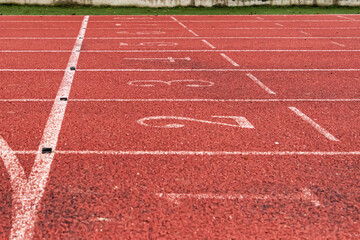 Fototapeta premium Athletics track number on the running track in the stadium