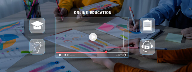 A vibrant workspace showcasing hands engaged in creative activities for online education, featuring colorful materials and digital tools for effective learning. Trope