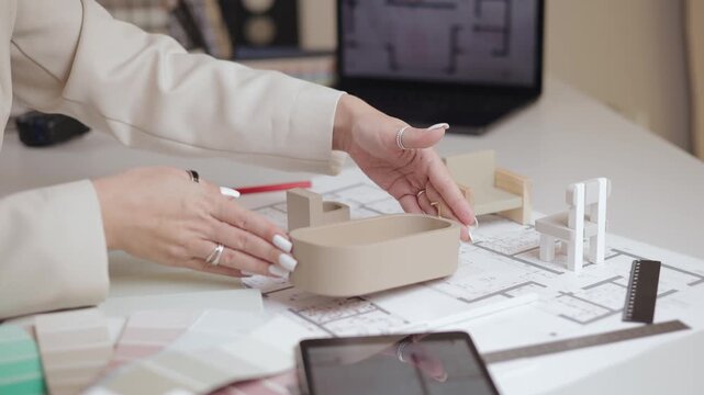 Interior design concept banner, Architectural model planning with blueprint and scale models by female designer, top view.