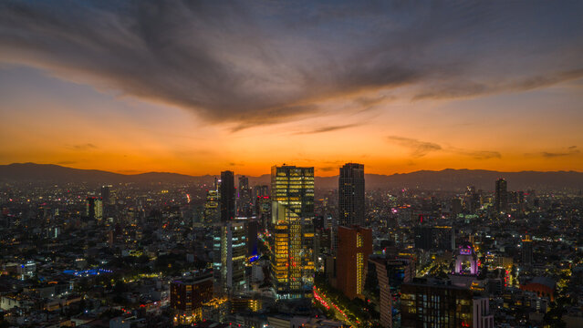 Aerial stunning sunset in Mexico City with views of Paseo de la Reforma and the skyline.