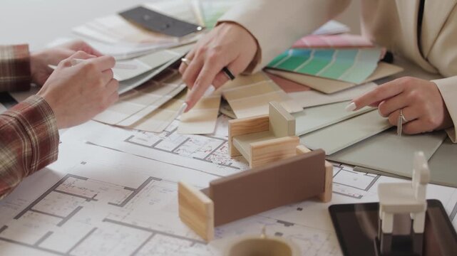 Concept presentation of design interior for client with color swatches and floor plans.