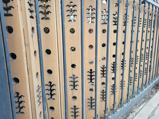 Wooden fence. Carved fence to protect the territory