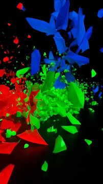 Abstract shot of illuminated red, green, and blue geometric shapes in a dark environment, with a sense of motion and dynamic energy.