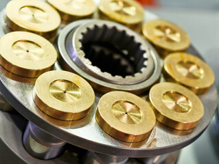 Hydraulic motor pistons showcasing precision engineering and metallic components in industrial...