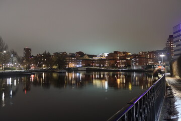 Fototapeta premium Sweden. Embankment on the river Motala stream in the city of Norrkoping. City of Norrkoping. Night city for New Year. Province of Östergötland. 