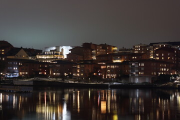 Fototapeta premium Sweden. Embankment on the river Motala stream in the city of Norrkoping. City of Norrkoping. Night city for New Year. Province of Östergötland. 