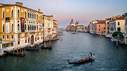 Obraz premium Sunset in Venice, view of Grand Canal and Basilica Santa Maria della Salute from Bridge Ponte dell'Accademia, Italy