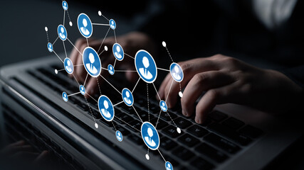 This image features hands typing on a laptop, overlaid with digital connection symbols. It illustrates networking and communication in today technology-driven world. Tessel