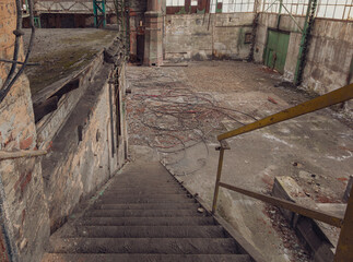 Steel staircase inside an industrial factory hall.
