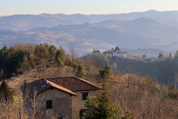 Stone house with tiled roof against the backdrop of the Asti Langhe landscape, Piedmont, Italy