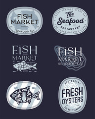 Fototapeta premium Set of signboards or labels for a restaurant or seafood market. Fish, oysters and letters into different forms. Vintage style signs.