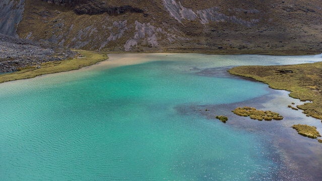 Aerial Drone View hike the seven 7 lakes of Ausangate cusco, Peru clouddy day green water mountains