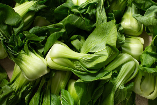 A top down view of a pile of shanghai bok choy, as a background.