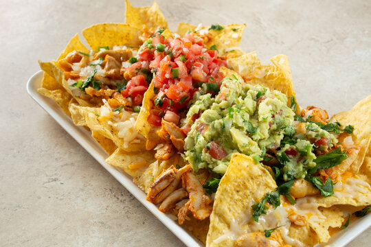 A view of a plate of dairy-free, gluten-free nachos pollo asado.