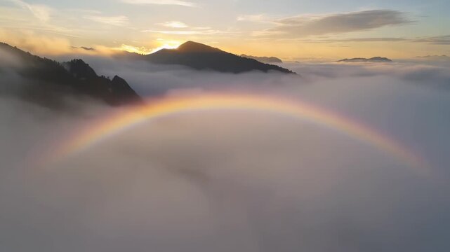 Cinematic shot of a "Fog Bow" (white rainbow) appearing over a misty mountain valley at sunrise, soft pearlescent colors, dreamlike and rare.