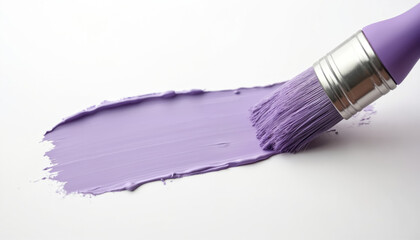 Obraz premium Wide brush spreads light purple paint on white surface. Artist applies color with smooth stroke for creative home decor project. Craftsmanship for wall painting and design.
