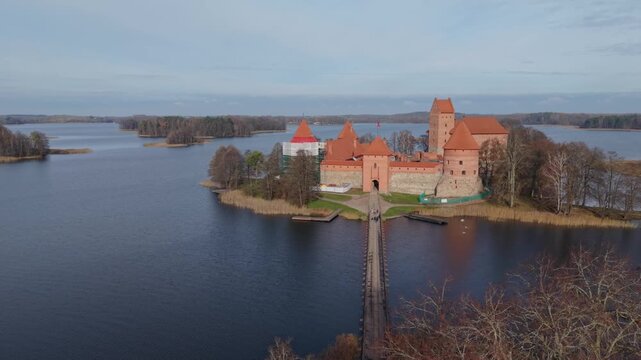 Trakai Island Castle Traku Pilis In Lithuania Traveler Viewpoint Along Causeway To Trakai Island Castle Bridge Approach Backpacker Framing Travel Photographer Scouting Scenic Itinerary