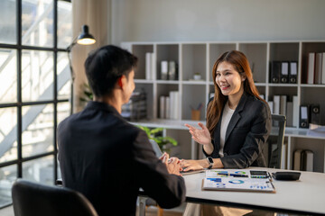 Fototapeta premium Businesswoman conducting job interview with male applicant