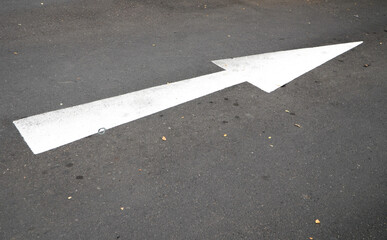 arrow on the road. Directional arrow on asphalt road surface in urban area