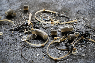 environmental pollution by wires and cables. soil contamination by household waste. environmental problem. waste from cable and pipe repairs.