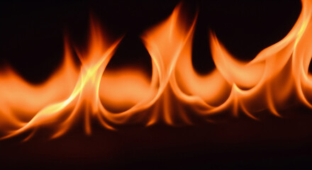 Fototapeta premium Dynamic Fiery Blazes: Warm Orange and Yellow Flames on Black