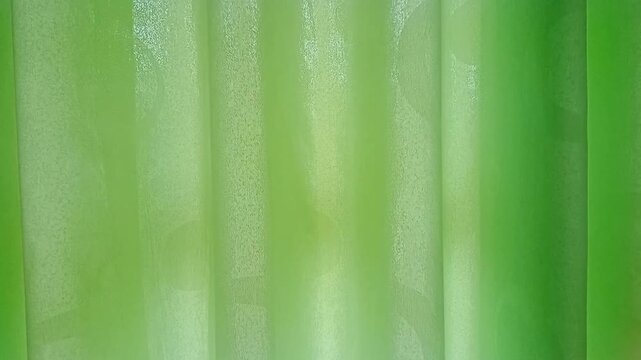 green,Bright green fabric background, thin fabric texture with folds.&nbsp;Perfect for design backgrounds, banners, or other creative projects.
