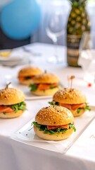 Close-up of mini sandwiches with salmon, greens, and sesame seeds