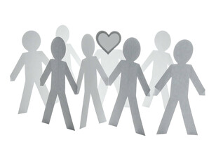 A grayscale paper chain of figures holding hands, one with a heart.  Black background. Depicts unity and love