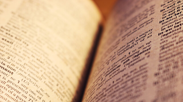 Blurry image dictionary page with out of focus. Photo for learning, studying, knowledge, reading, hobby, school, student, teacher, university, English language, book.