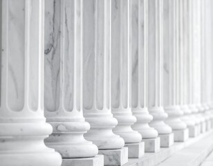 Classic white columns in a row, with fluted details, a perspective view