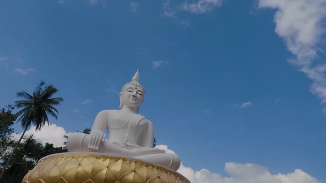Timelapse of white buddha statue in thailand.