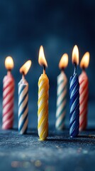 Lit Rainbow Candles Dark Blue Backdrop