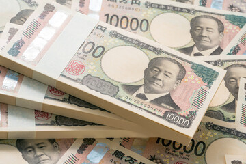 一万円札の束が並んだ背景