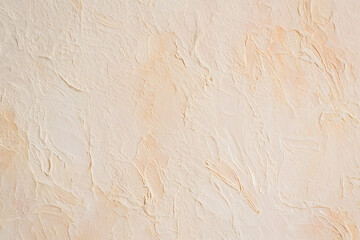 Fototapeta premium A subtle light beige and off-white textured wall surface with gentle, irregular patterns creates a soft, minimalist background.