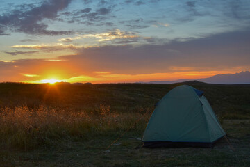Sunrise over a tourist tent on the Lagonaki plateau, Adygea Republic of Russia © pdeminhiker