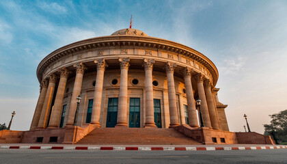 Indian Parliament building in New Delhi captured from a low angle under blue sky, showcasing iconic circular architecture representing democracy, governance, and legislative authority of India