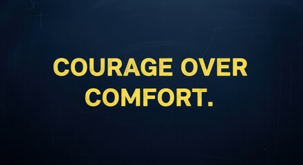 Fototapeta premium Courage Over Comfort Motivational Quote on Dark Blue Background to Inspire Strength and Determination