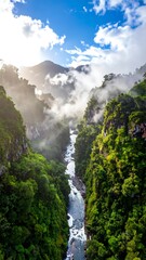Aerial view of a lush mountainous landscape with a waterfall