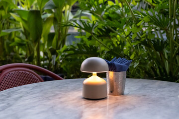 Table lamp with tissue paper on the table, in fine dining restaurant