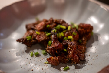 Stir fried meat served on plate