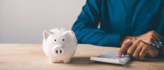 Tax planning and saving money in piggy bank, financial invest retirement concept, person using...