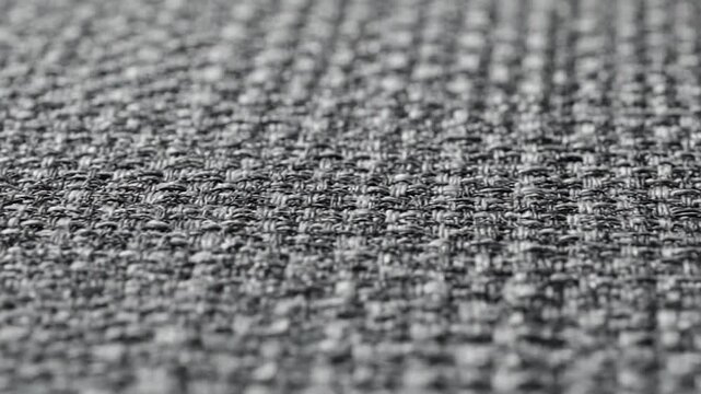 Macro view of textured grey fabric with woven threads