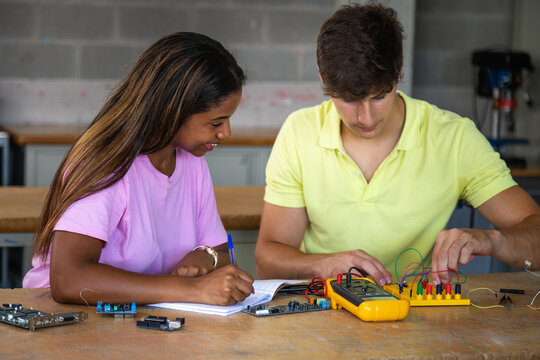 Students learning electronics and stem skills in classroom