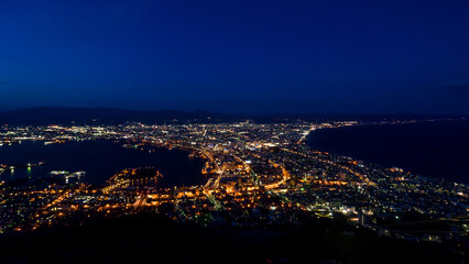 Famous panoramic cityscape of glittering illuminated streets at night (Hakodate, Hokkaido, Japan)