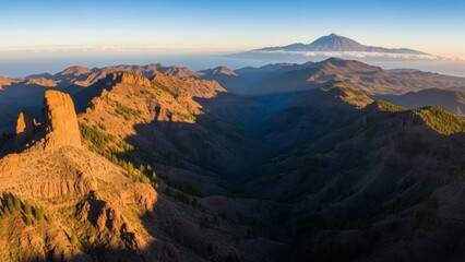 Aerial View of Mountainous Landscape at Sunrise.
