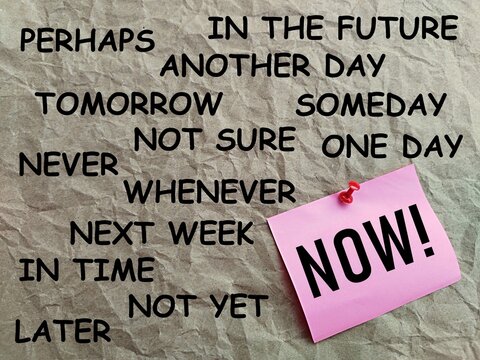 Pink note paper written NOW with a gray background printed with many words concept of working without delay, just do it without many excuses
