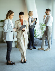 Business meeting in a modern office space with professionals discussing ideas