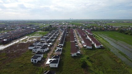 Aerial view of a quiet village area in a rice field area