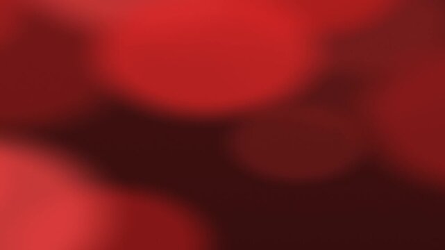 Abstract red background with blurred shapes and soft focus for design.